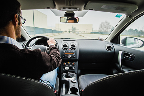 man driving car
